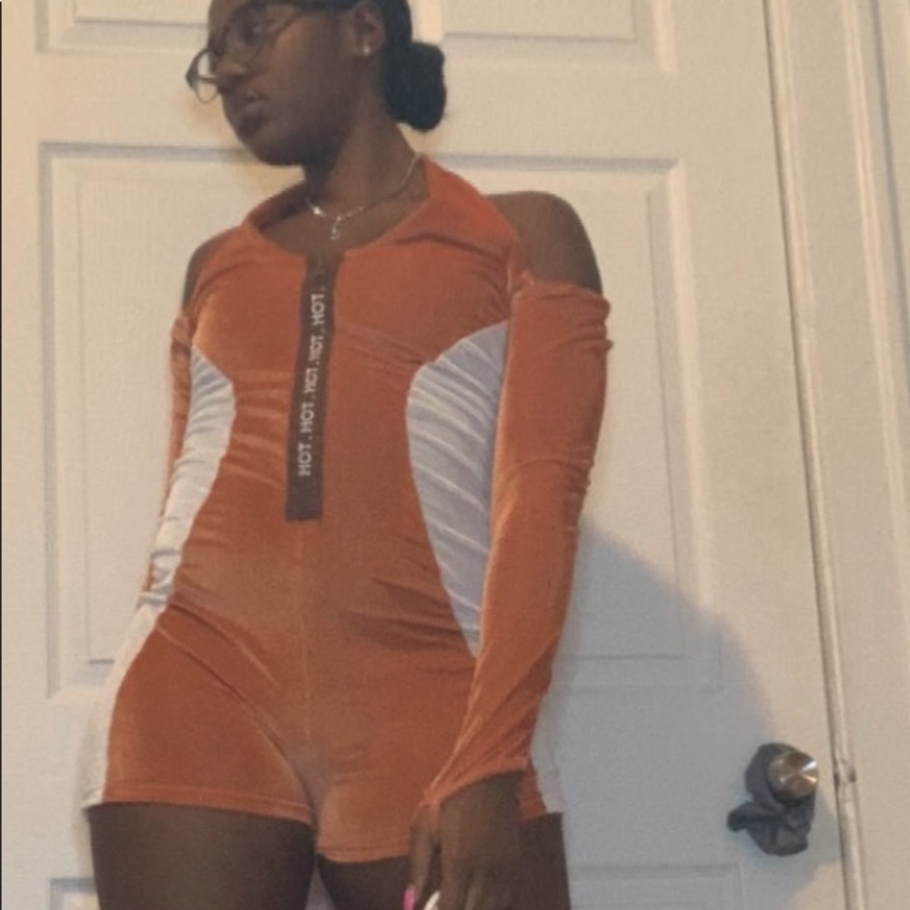 Orange and White jumper with brown on the front